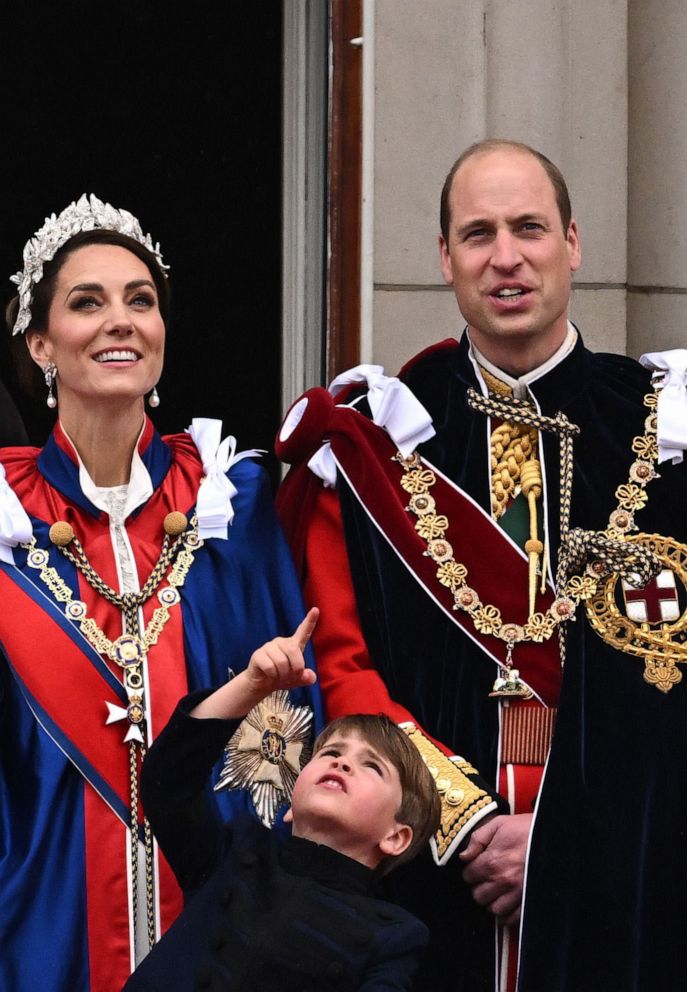 PHOTO: Britain's Catherine, Princess of Wales, Britain's Prince Louis of Wales and Britain's Prince William, Prince of Wales on the Buckingham Palace balcony in central London on May 6, 2023.