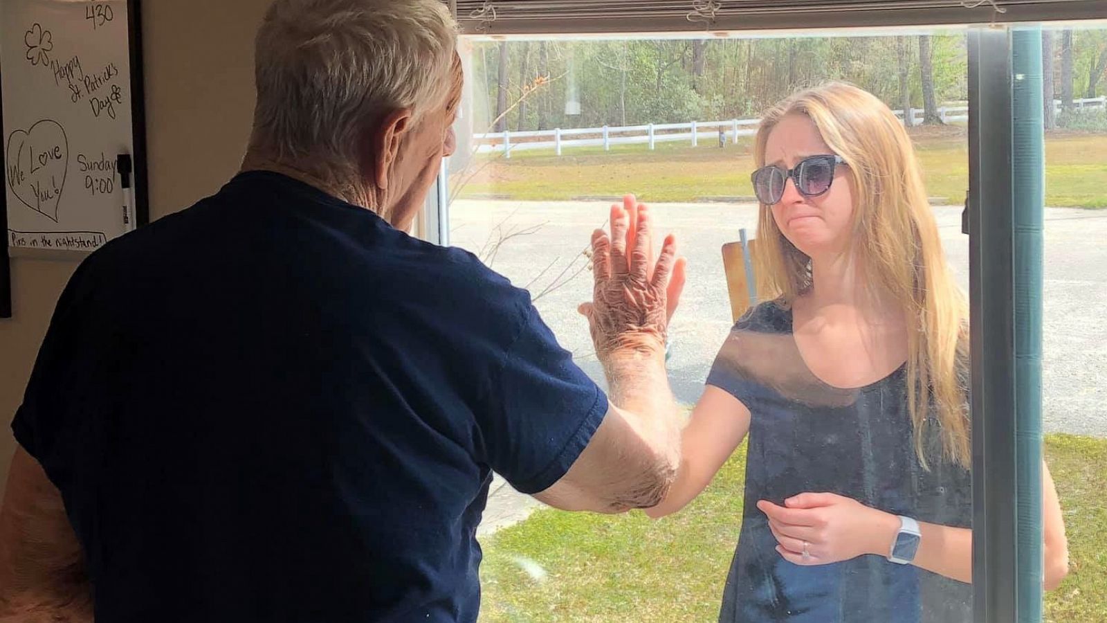 PHOTO: Carly Boyd announces her engagement to her grandfather Shelton Mahala, 87, through his nursing home window in Lake Waccamaw, N.C., in a photo shared on Facebook March 16, 2020.