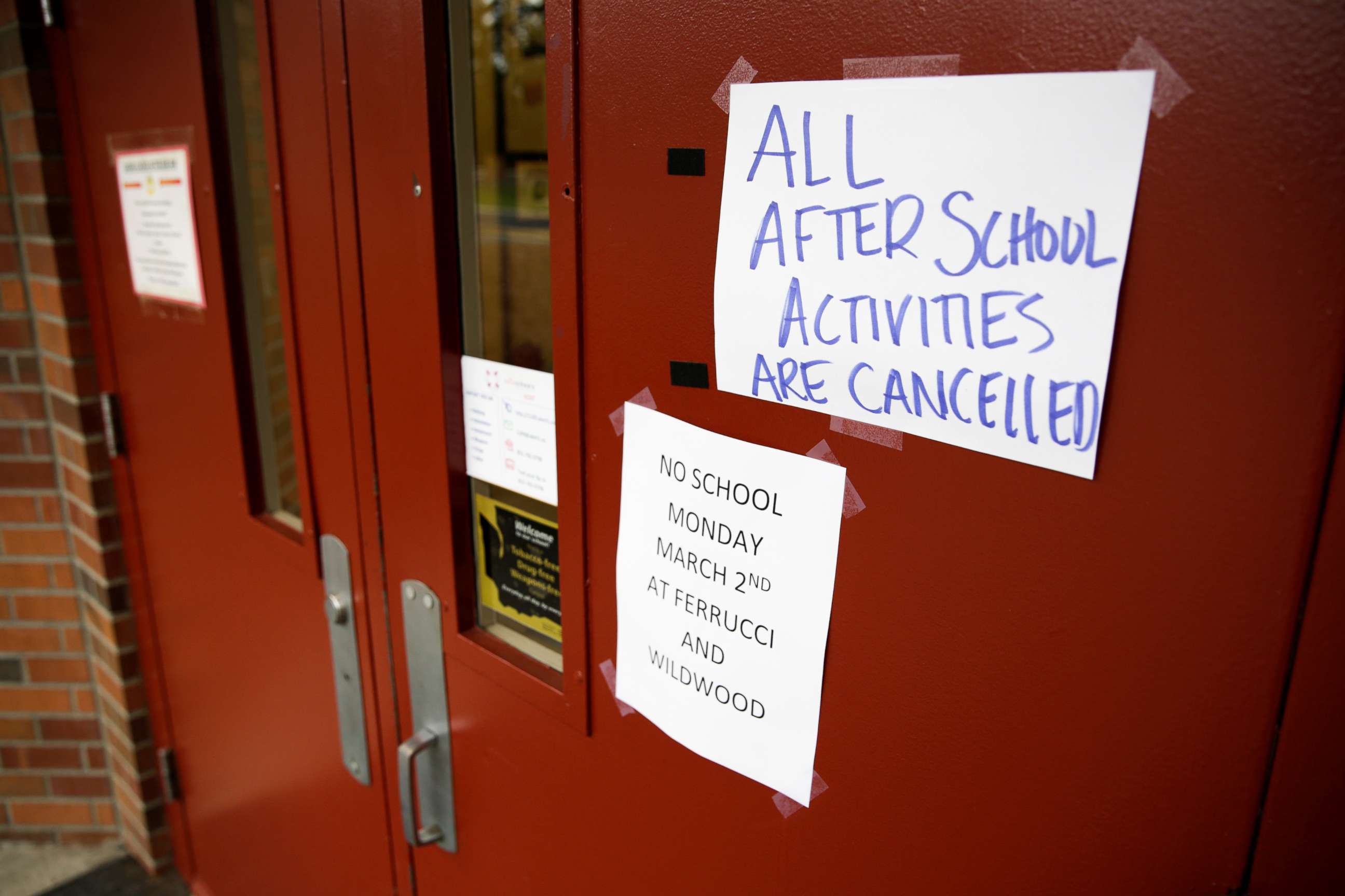 PHOTO: Signs announcing a closure and cancelled activities are pictured at Ferrucci Junior High School after two schools were closed for cleaning due to flu-like symptoms of a relative in Puyallup, Washington, March 2, 2020.