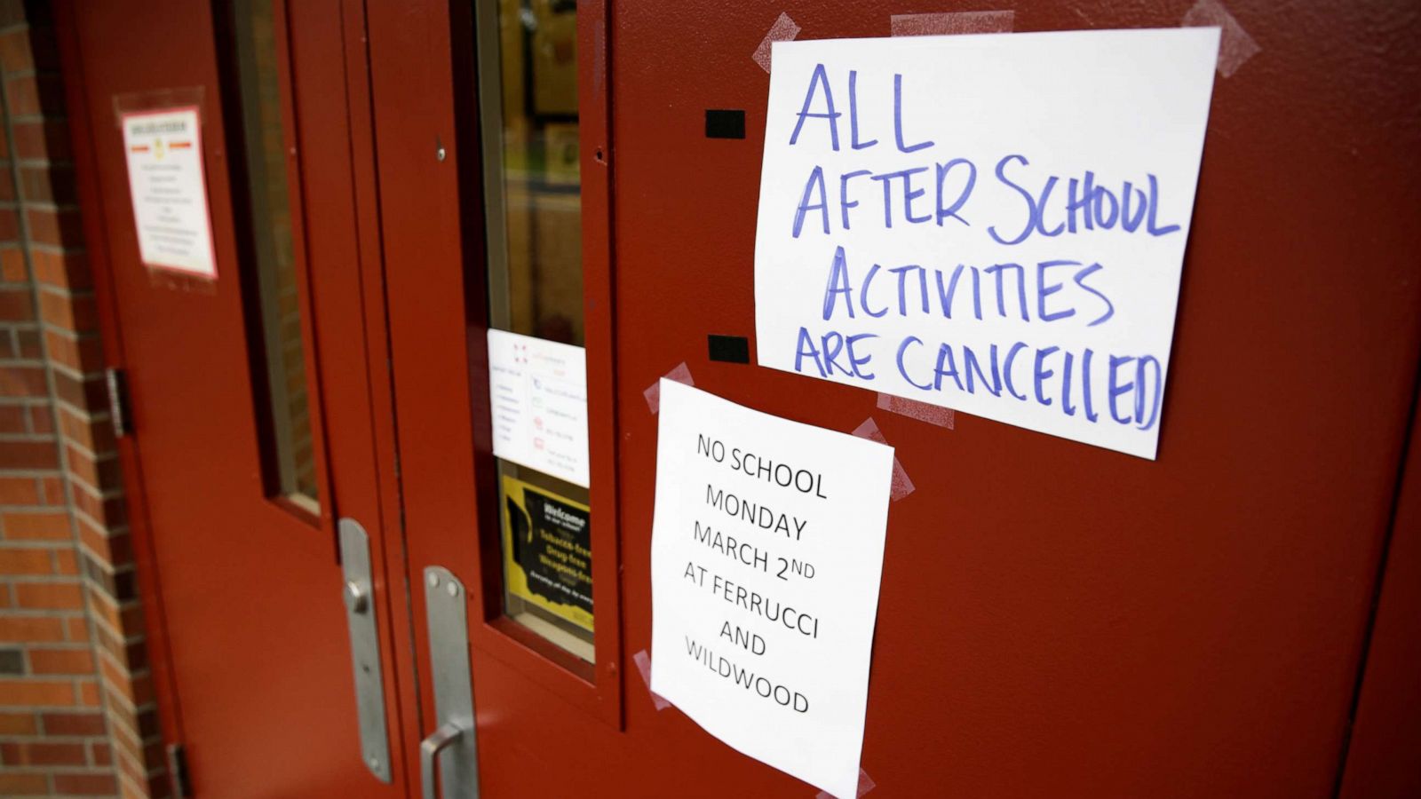 PHOTO: Signs announcing a closure and cancelled activities are pictured at Ferrucci Junior High School after two schools were closed for cleaning due to flu-like symptoms of a relative in Puyallup, Washington, March 2, 2020.