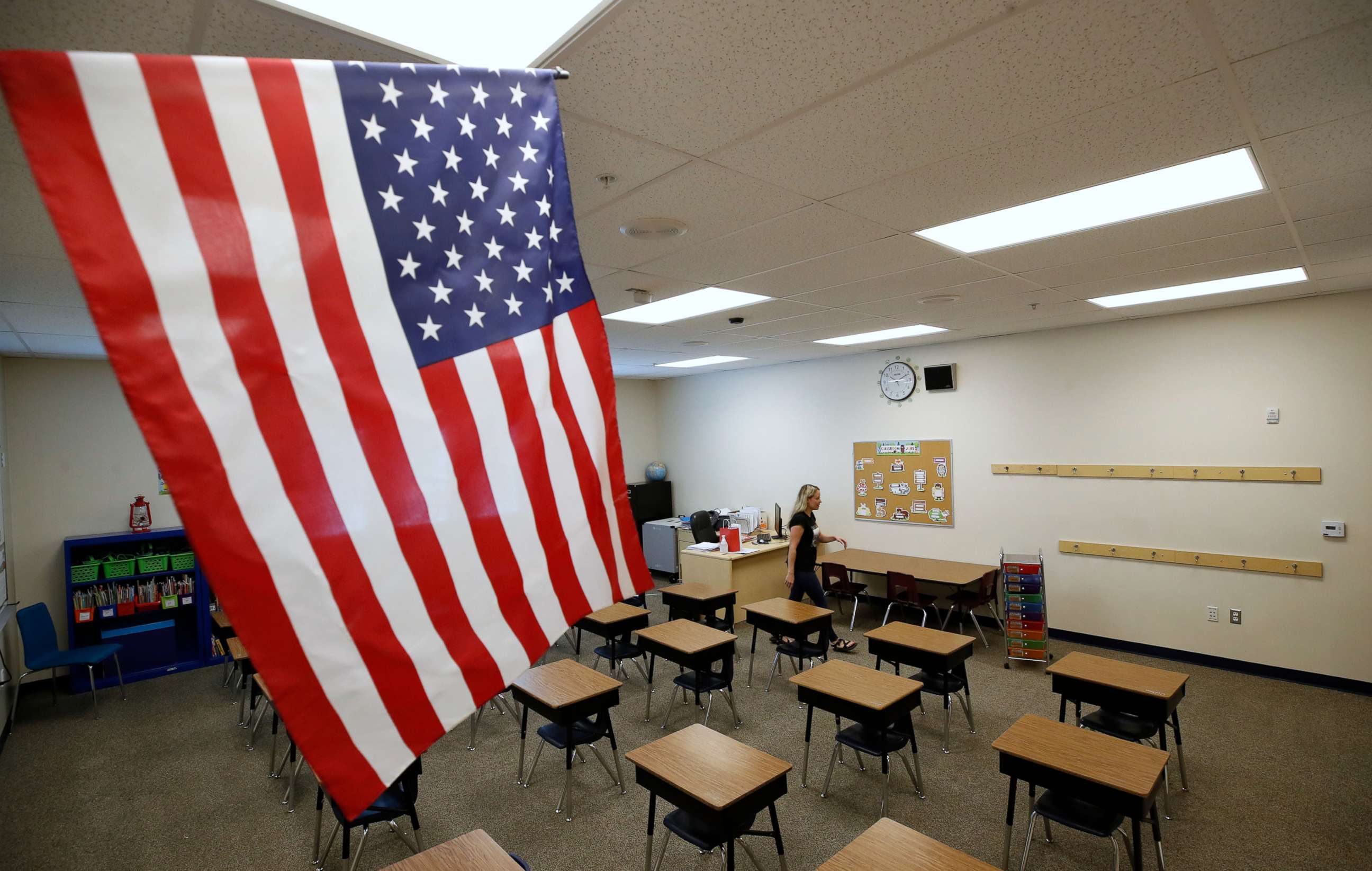 PHOTO: A teacher sets up her classroom to restart school at Freedom Preparatory Academy in Provo, Utah, Aug. 13, 2020.
