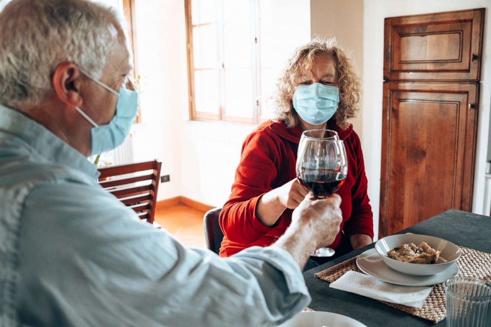 PHOTO: A couple enjoy a meal during the coronavirus pandemic in this stock photo.
