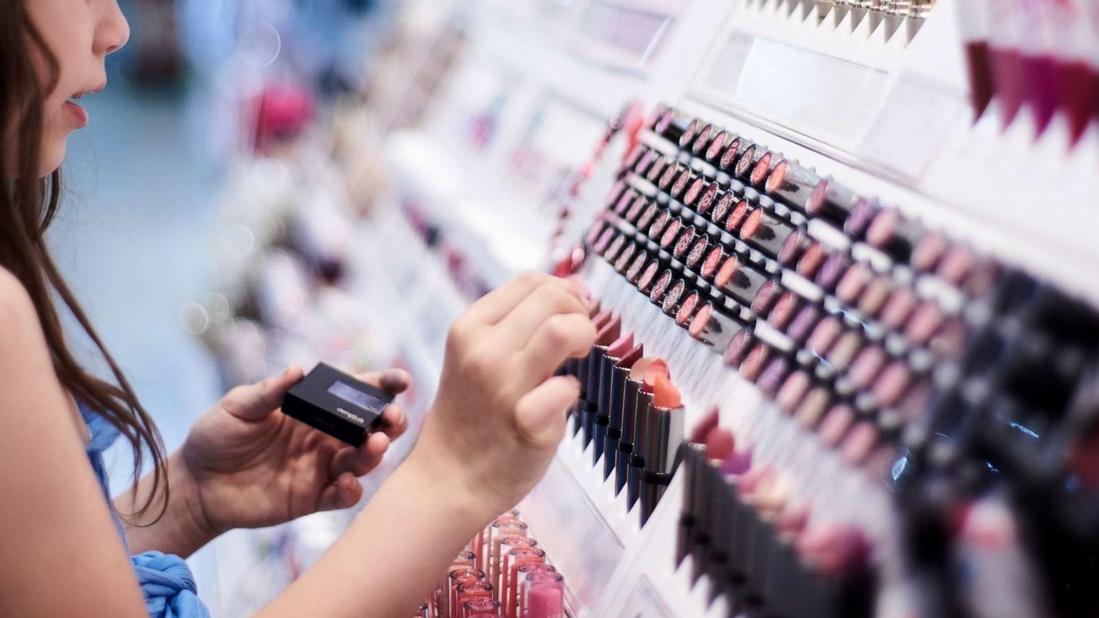 PHOTO: A young woman shops for cosmetics in this stock photo.