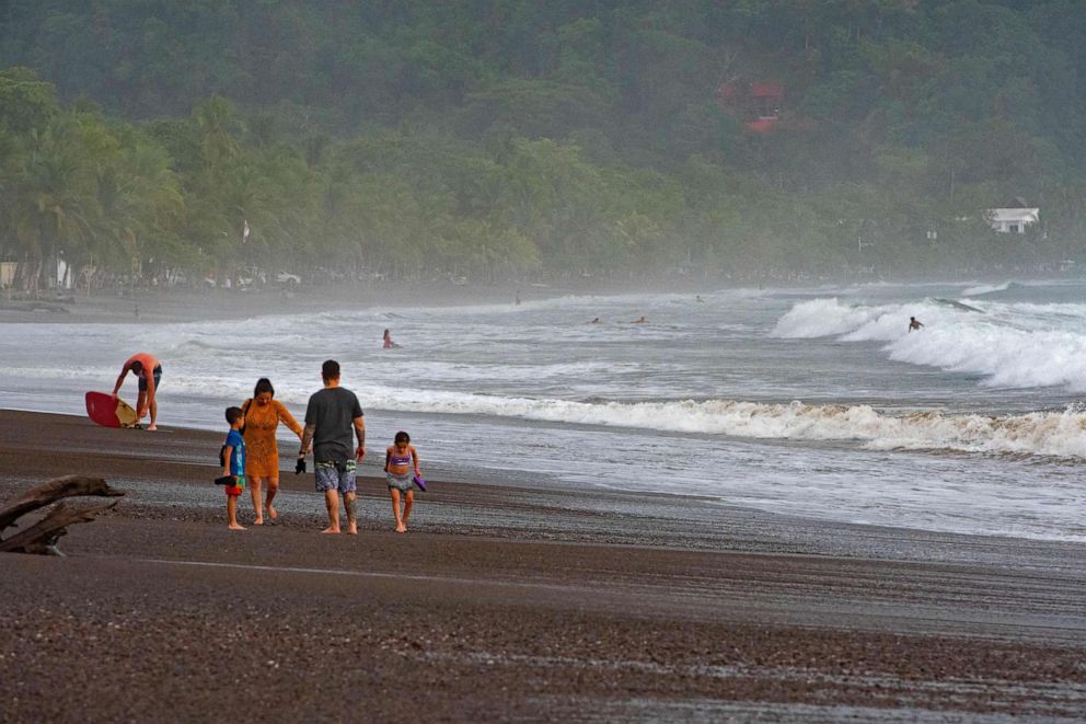 PHOTO: Tourists enjoy the Jaco beach in Puntarenas, Costa Rica, on May 27, 2021.