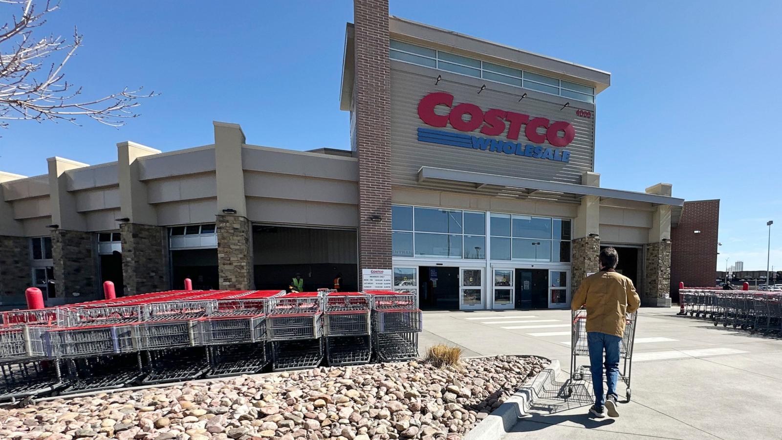 PHOTO: A shopper pushes a cart toward the entrance of a Costco warehouse, March 13, 2025, in Sheridan, Colo.