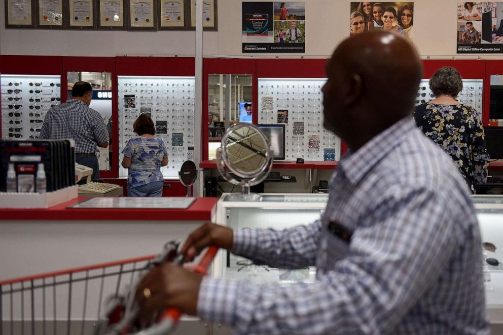 PHOTO:A customer pushes a shopping cart past the optical department at a Costco Wholesale Corp. store in San Antonio, Texas, May 30, 2018.