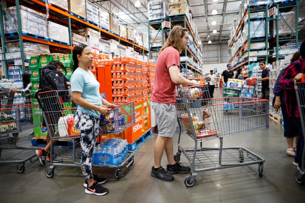 PHOTO: Customers wait in line to check out purchases at Costco store on June 28, 2023 in Teterboro, New Jersey.