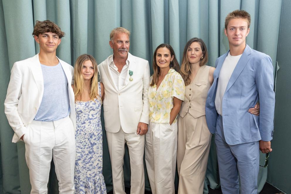 PHOTO: Kevin Costner receives the Order of Arts and Letters from the Minister of Culture with (L-R) Hayes Logan Costner, Grace Avery Costner, Kevin Costner, Annie Costner, Lily Costner and Cayden Wyatt Costner on May 19, 2024 in Cannes, France. 