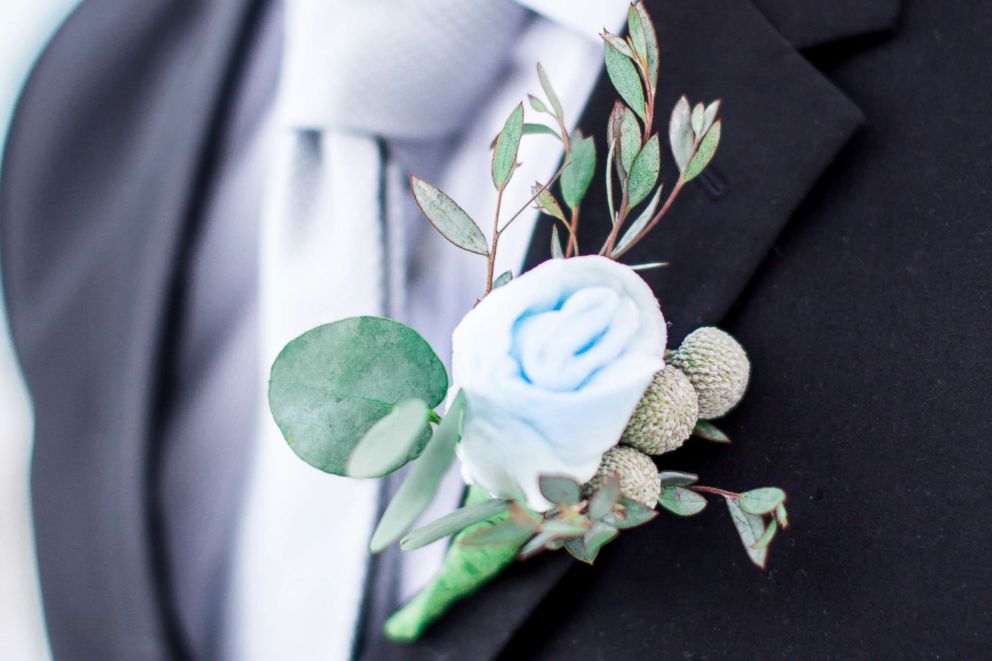 PHOTO: A model displays a boutonniere flower crafted from cotton candy in a wedding-style photo shoot by Milwaukee-based wedding photographer Lottie Lillian.