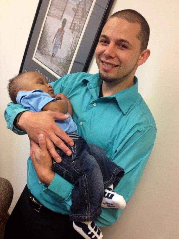 PHOTO: Shannon Fessenden of White Cloud, Michigan, is seen holding his son Mason, 2.