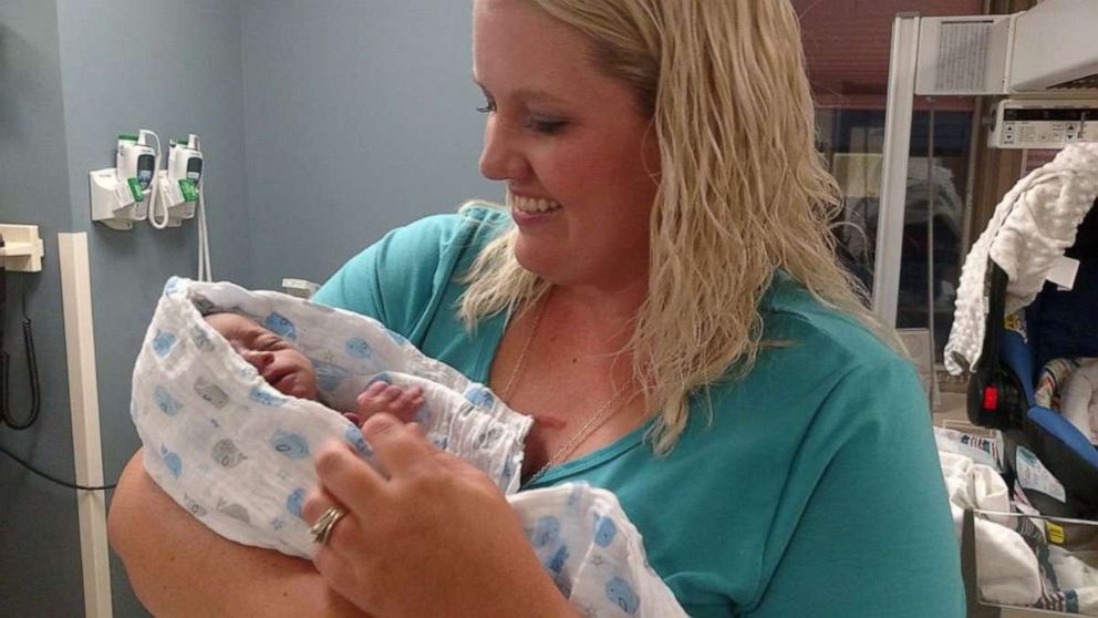 PHOTO: Gabrielle Fessenden of White Cloud, Michigan, is seen holding her adopted son, Mason in 2017, after he was born. 