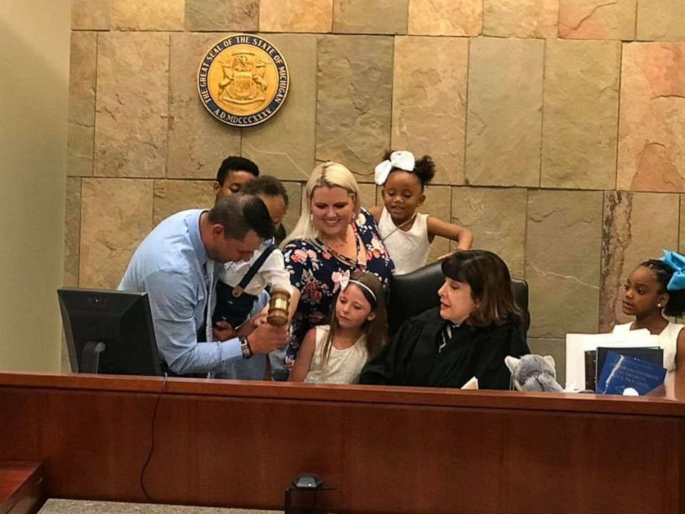 PHOTO: Gabrielle Fessenden and Shannon Fessenden of White Cloud, Michigan, are seen with their children June 12, 2019, during their son Mason's adoption hearing.