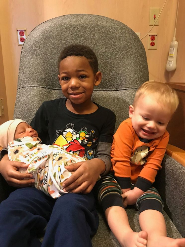 PHOTO: Milo Weight, 5 and his brother Nash Weight, 2, hold their baby sister Onni Weight, 3 months after her 2019 adoption in Utah. 