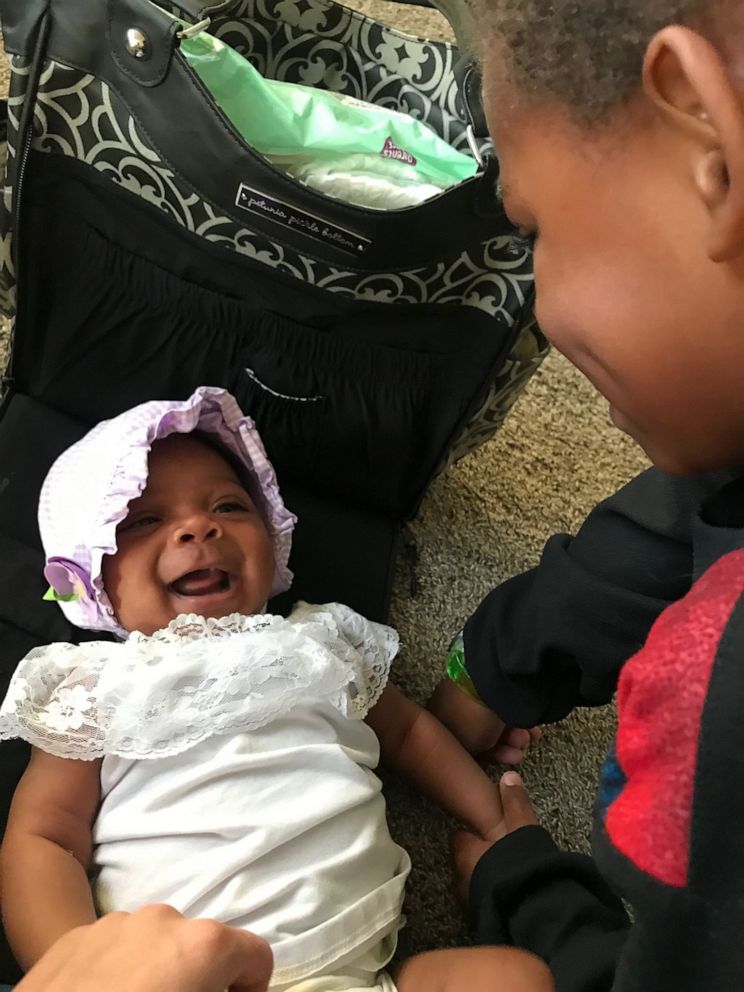 PHOTO: Onni Weight, 3 months, laughs with her older brother Milo, 5. Onni and Milo share the same birth mother.