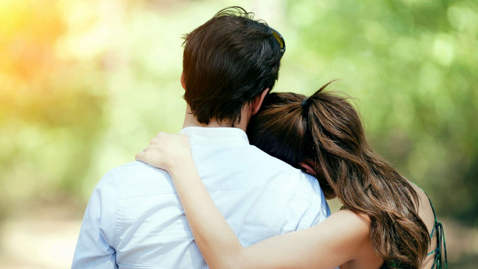PHOTO: Young couple hug in this stock photo.