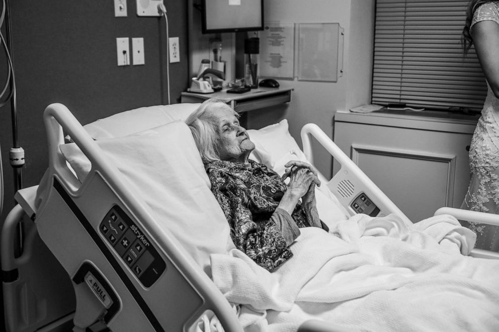 PHOTO: Charlotte Bussard, 100, looks on as her grandson, Clay Cameron, weds Sky Howard at Hemphill County Hospital in Hemphill County, Texas.