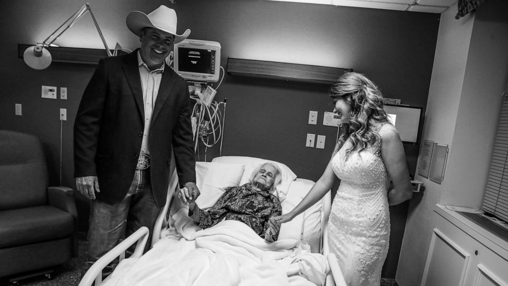 PHOTO: Clay Cameron, weds Sky Howard in an unofficial ceremony at Hemphill County Hospital in Hemphill County, Texas, beside his grandmother, harlotte Bussard, 100.