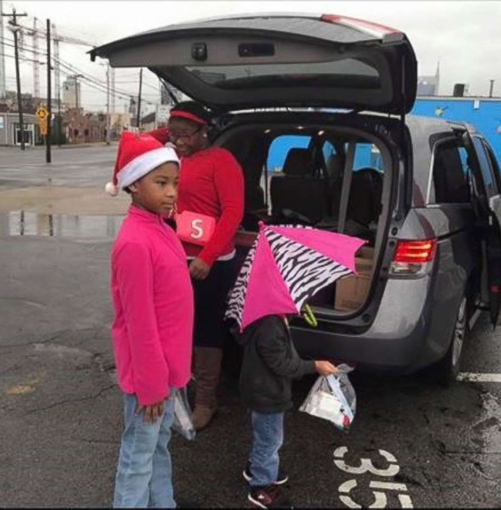 PHOTO: Latiaa Stewart's three children help her hand out care packages.