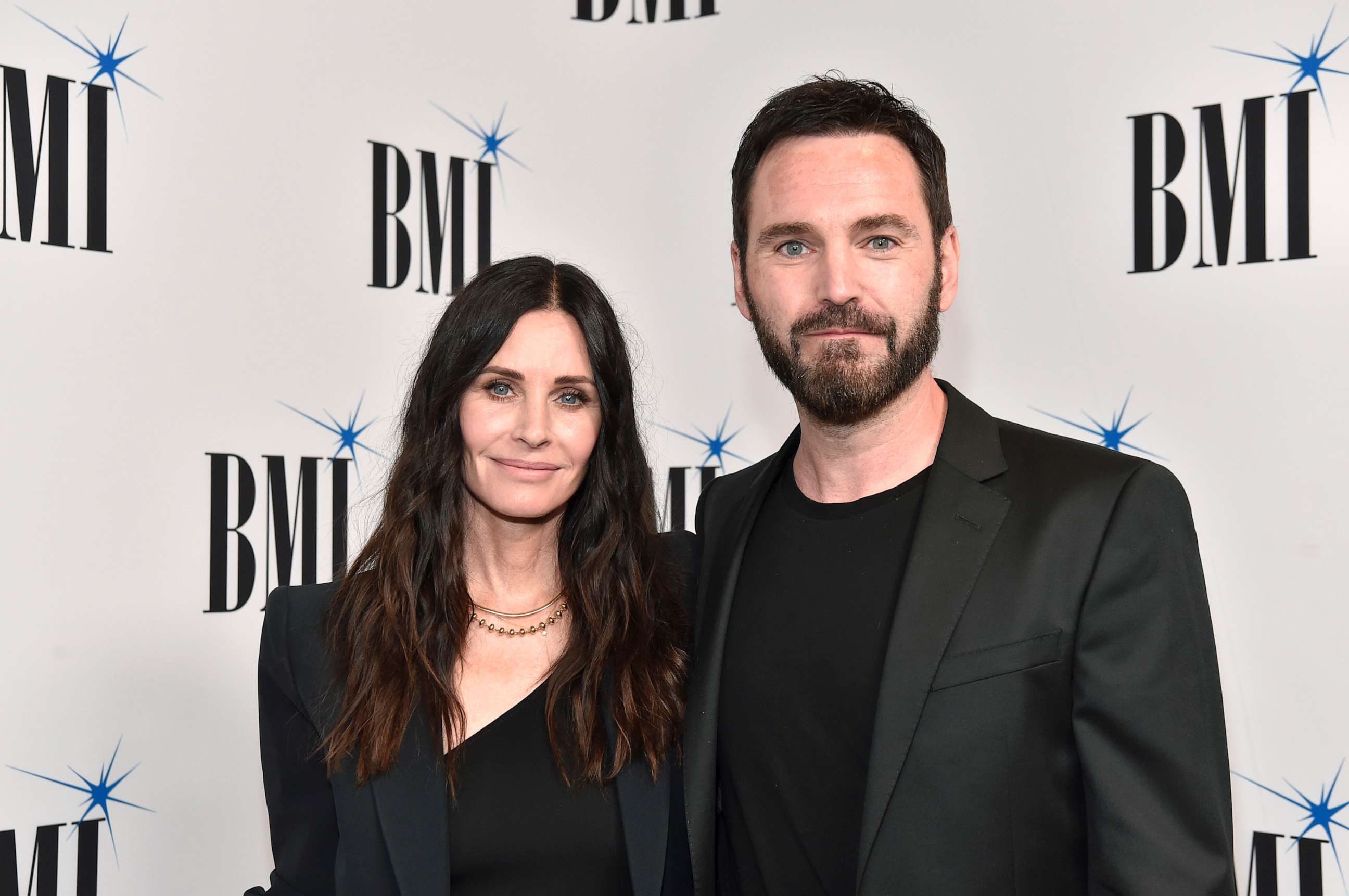 PHOTO: BEVERLY HILLS, CALIFORNIA - MAY 10: (L-R) Courteney Cox and Johnny McDaid attend the 70th Annual BMI Pop Awards at Beverly Wilshire, A Four Seasons Hotel on May 10, 2022 in Beverly Hills, California. (Photo by Rodin Eckenroth/FilmMagic)