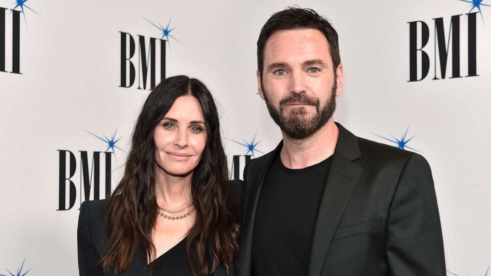 PHOTO: BEVERLY HILLS, CALIFORNIA - MAY 10: (L-R) Courteney Cox and Johnny McDaid attend the 70th Annual BMI Pop Awards at Beverly Wilshire, A Four Seasons Hotel on May 10, 2022 in Beverly Hills, California. (Photo by Rodin Eckenroth/FilmMagic)