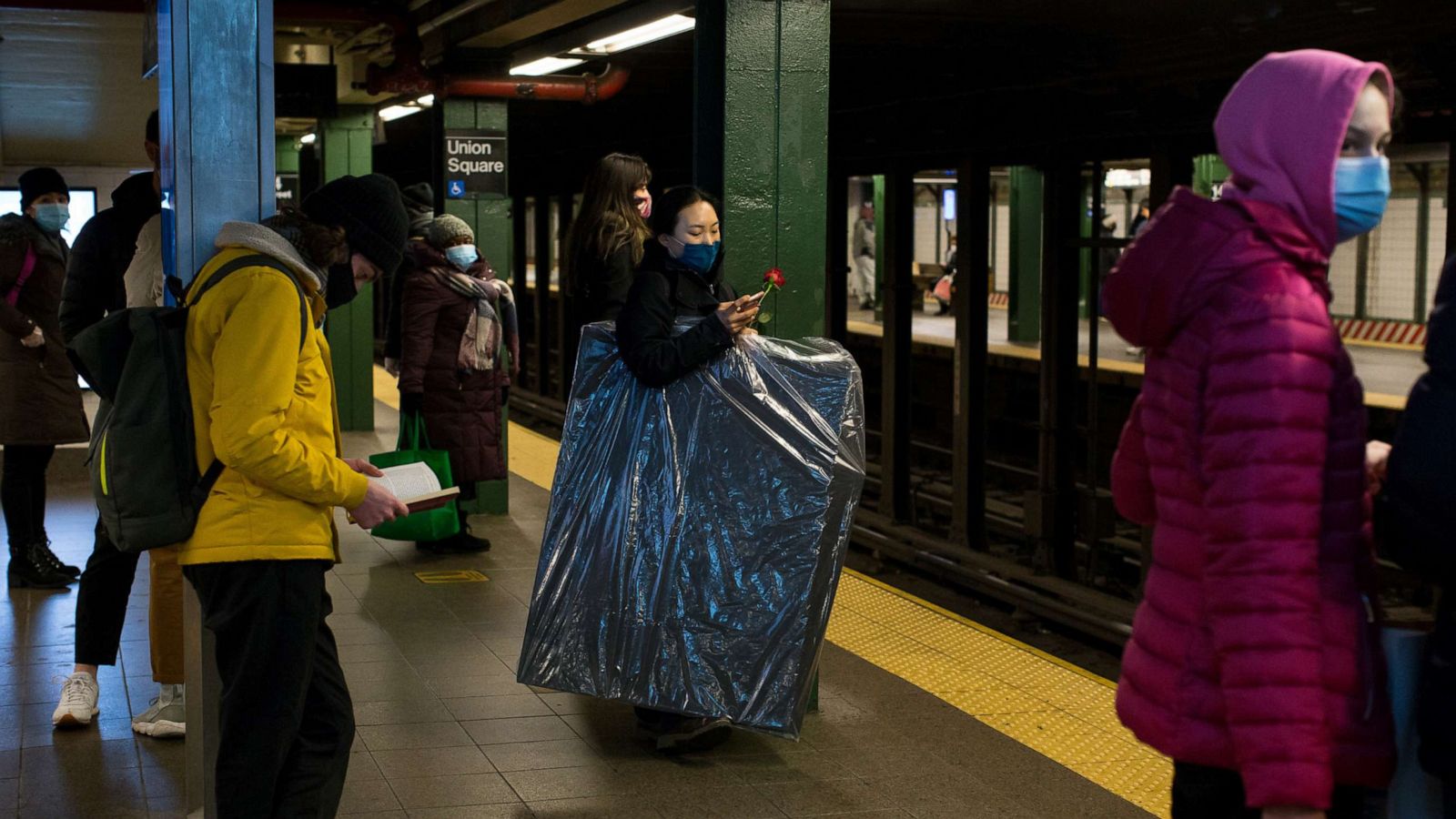 PHOTO: Passengers wait in a Union Square subway station in New York on Feb. 14, 2021.