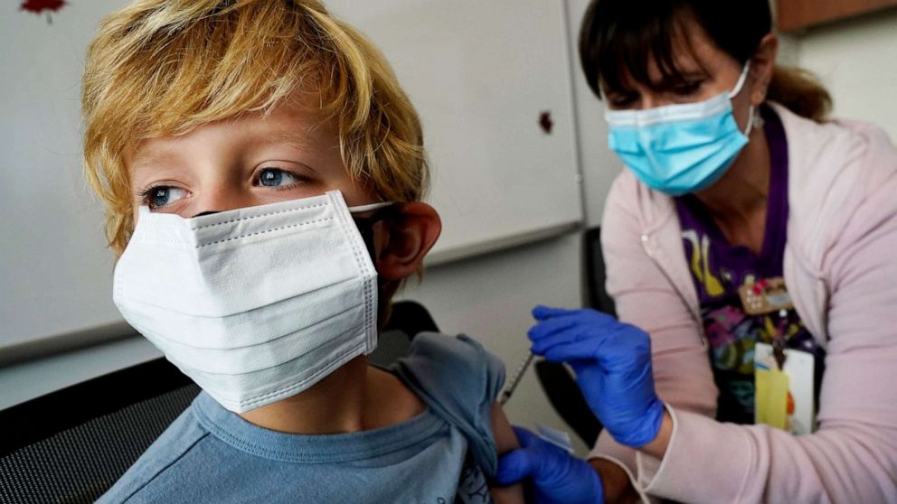 PHOTO: Owen Malloy, 9, receives the Pfizer COVID-19 vaccine for children 5 to 11 years from Lurie Children's hospital registered nurse Jeanne Bailey at Lurie Children's hospital, Nov. 5, 2021, in Chicago.