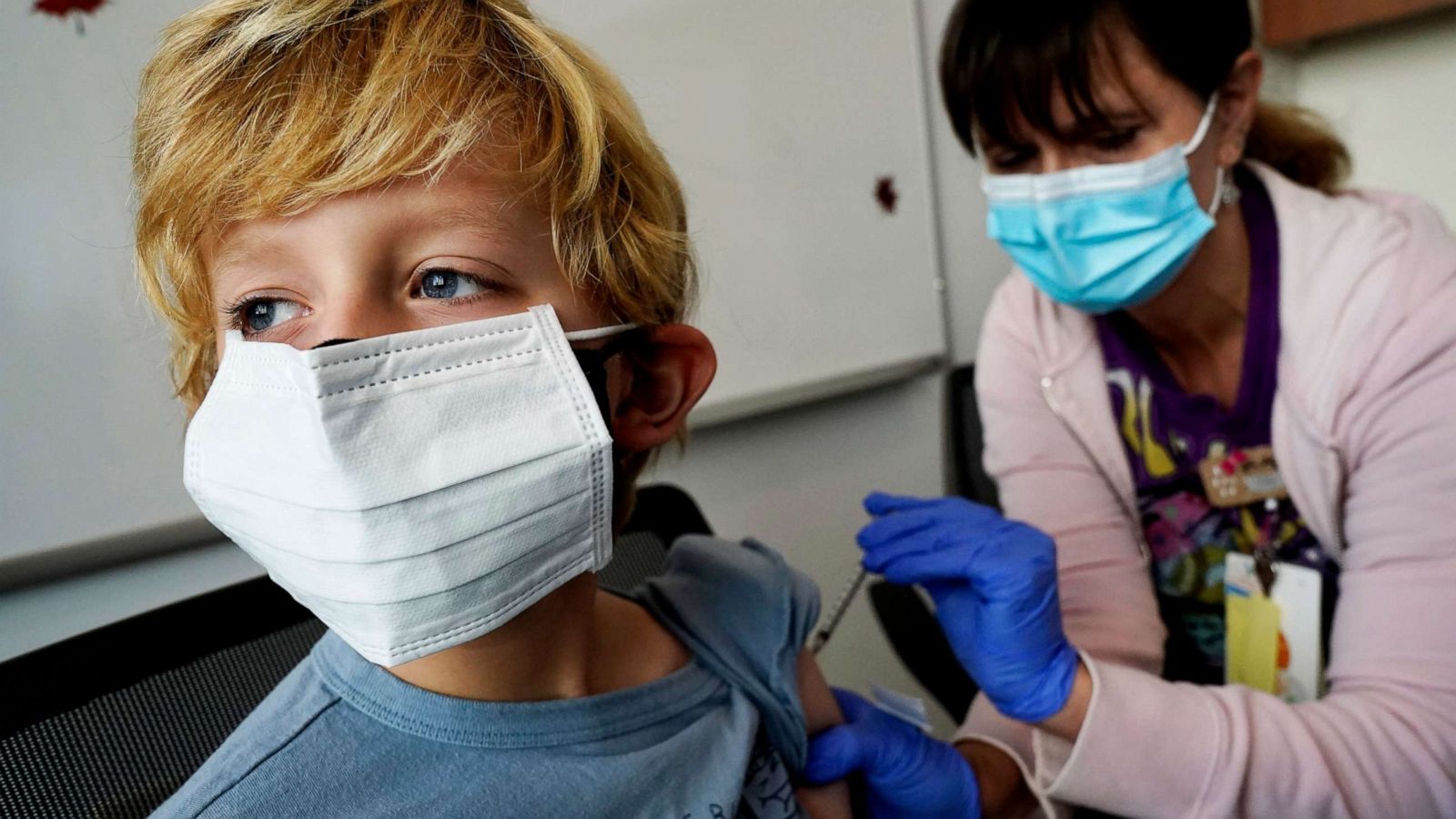 PHOTO: Owen Malloy, 9, receives the Pfizer COVID-19 vaccine for children 5 to 11 years from Lurie Children's hospital registered nurse Jeanne Bailey at Lurie Children's hospital, Nov. 5, 2021, in Chicago.