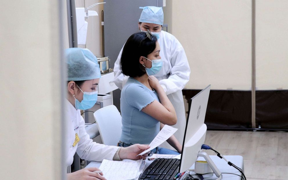 PHOTO: A woman receives a dose of coronavirus Sputnik V vaccine in Nur Sultan, Kazakhstan on April 16, 2021.