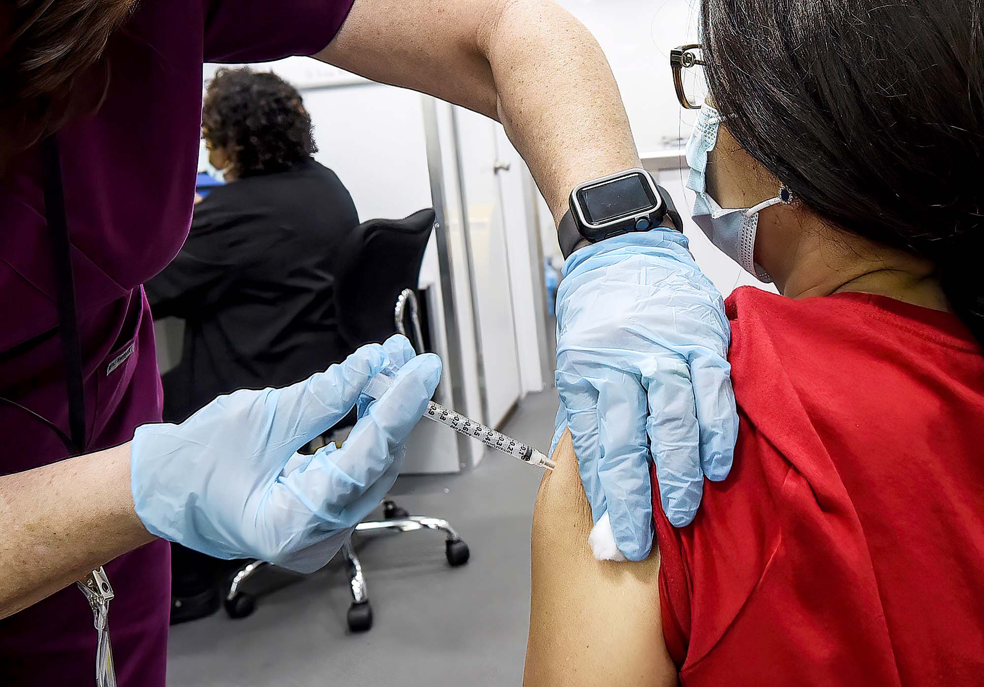 PHOTO: A nurse administers a dose of COVID-19 vaccine to a woman at a mobile vaccination event at the downtown campus of the University of Central Florida and Valencia College in Orlando, Fla., July 24, 2021.