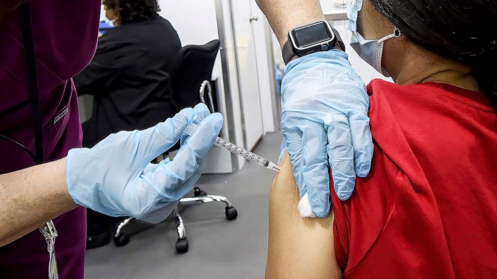 PHOTO: A nurse administers a dose of COVID-19 vaccine to a woman at a mobile vaccination event at the downtown campus of the University of Central Florida and Valencia College in Orlando, Fla., July 24 ,2021.