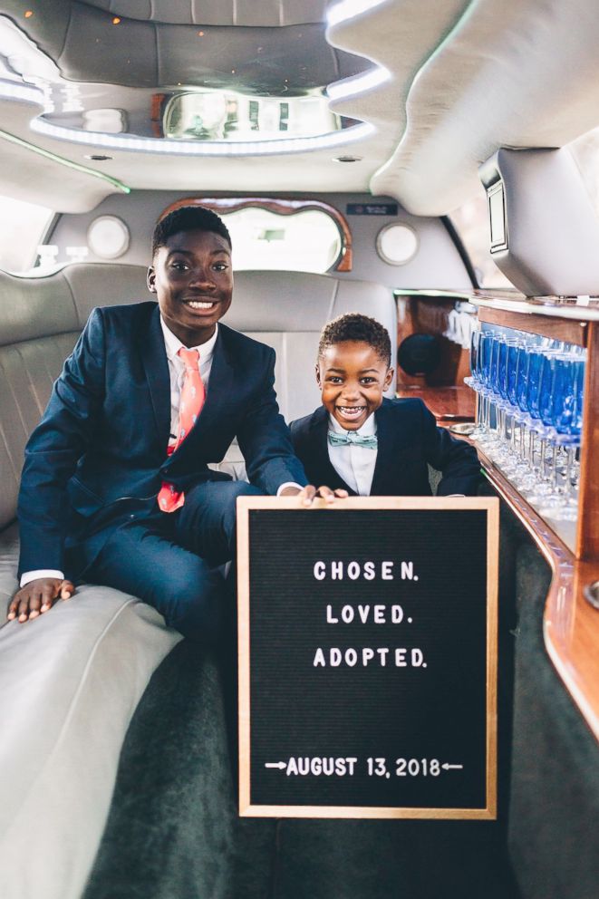 PHOTO: Dayshawn and Michael Shank pose for a photo on their adoption day, Aug. 13, 2018.