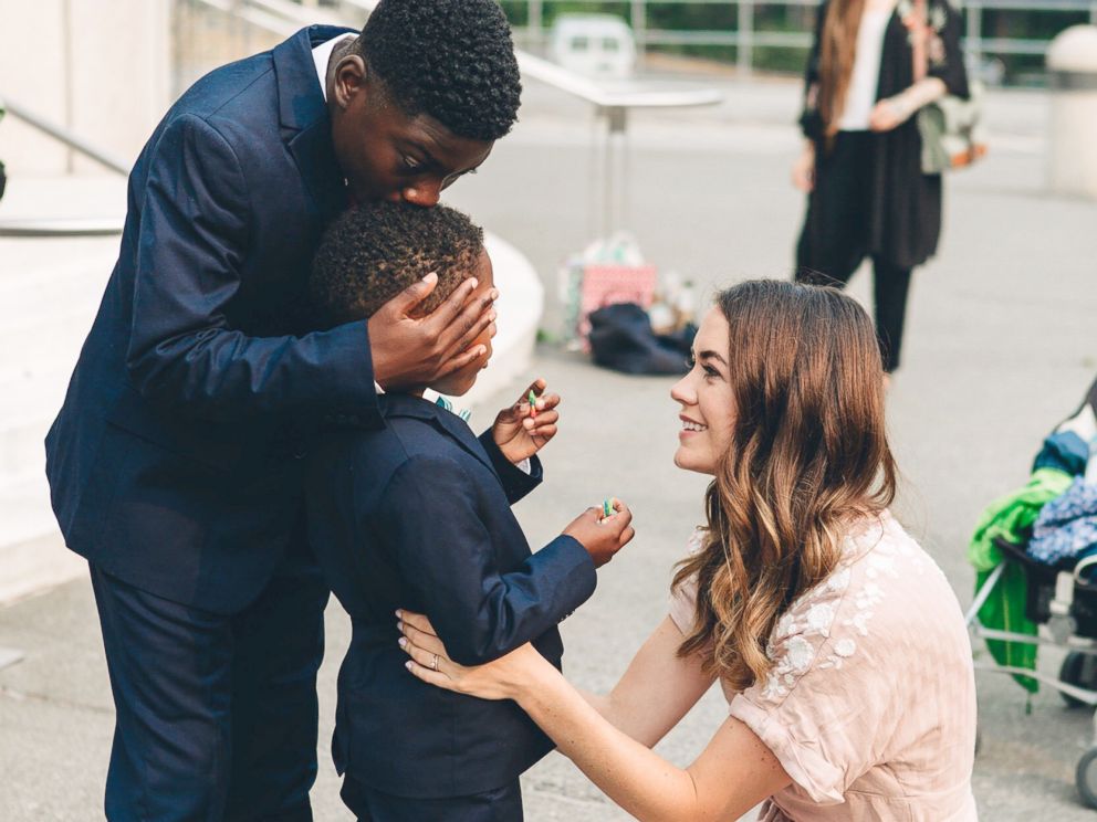 PHOTO: Dayshawn kisses Michael on the head while Sara Cozard looks on in this adoption day photograph, Aug. 13, 2018.