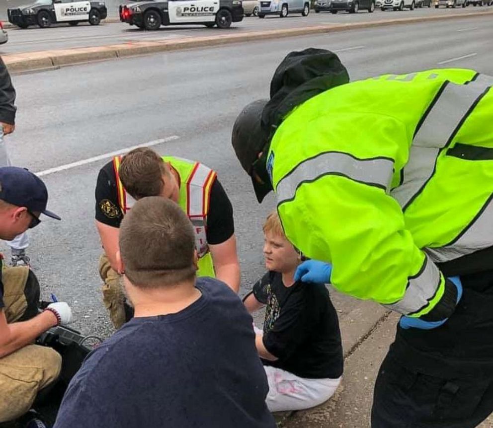 PHOTO: First responders speak with Braeden McLellan, 9, after he was involved in a Sept. 15 car crash in New Mexico.