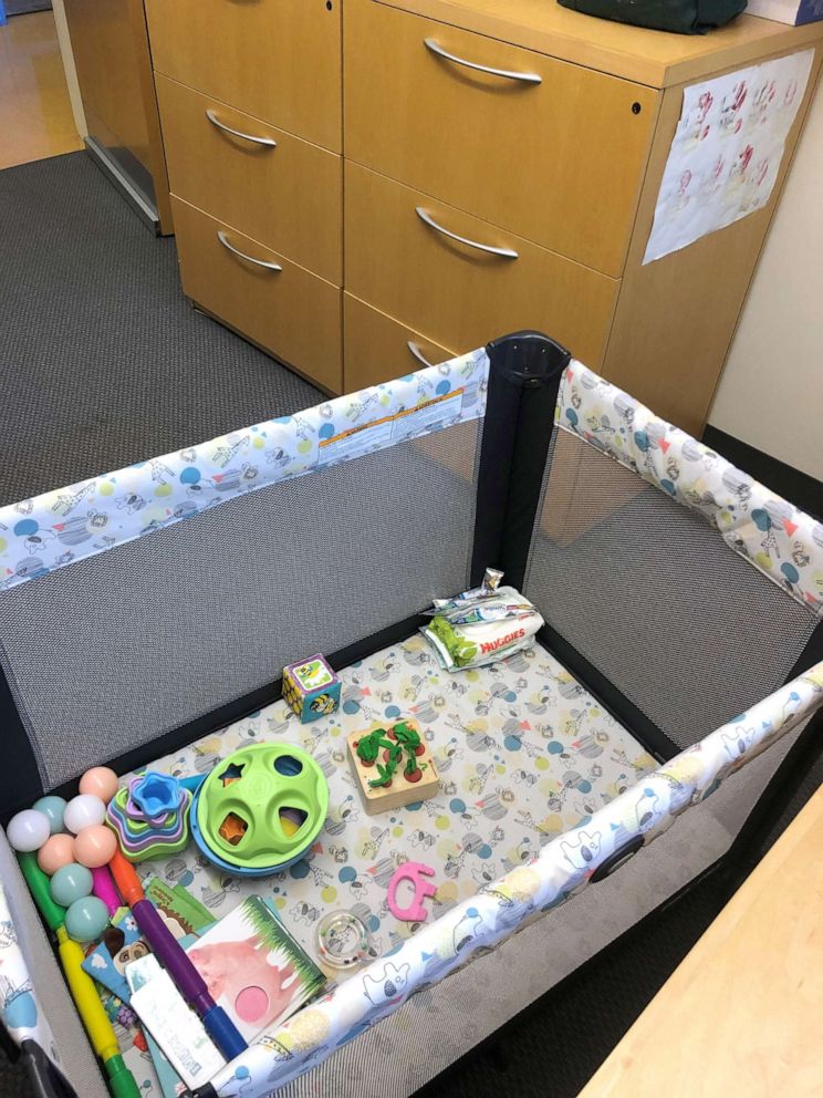 PHOTO: MIT professor Troy Littleton keeps a portable crib in his office to help provide backup child care for the infant daughter of one of his graduate students.
