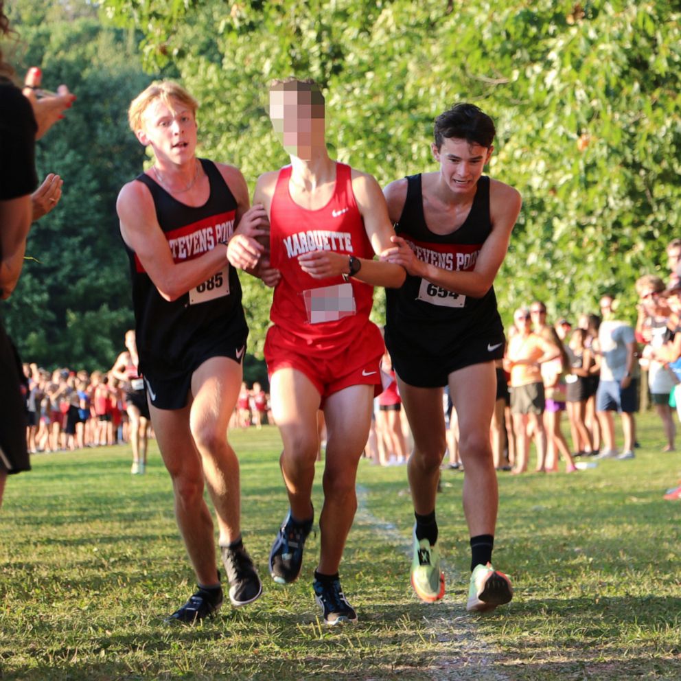 VIDEO: High school cross-country runners help fallen competitor cross finish line