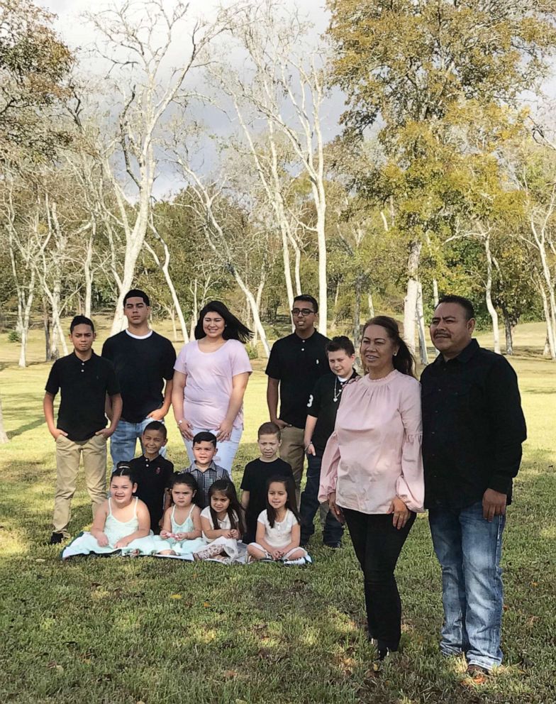 PHOTO: Rosa Rodriguez and her 12 grandchildren. 