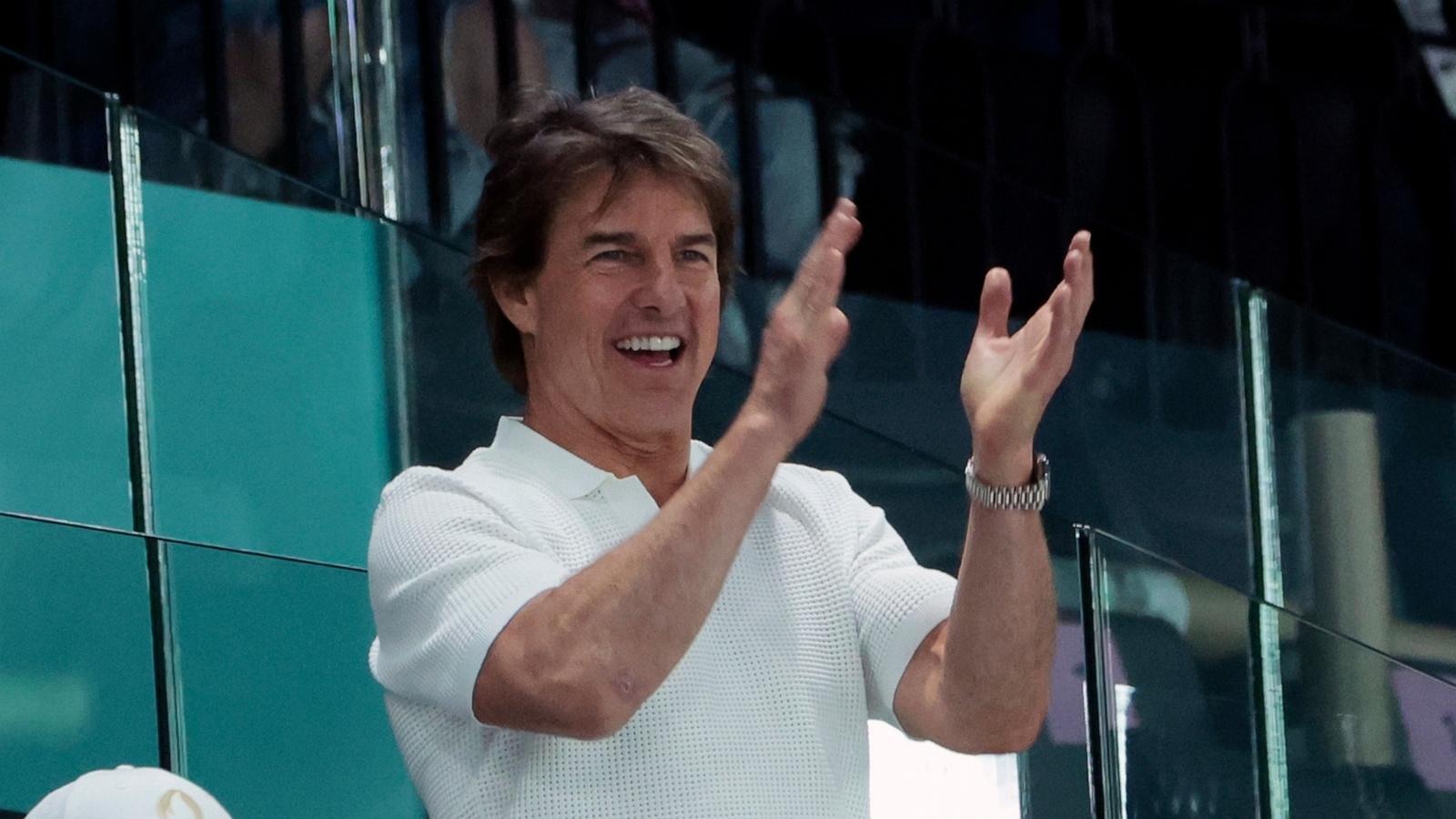 PHOTO: Tom Cruise attends day two of the Paris 2024 Olympic Games at the artistic gymnastics event with Simone Biles of USA at Paris Arena on July 28, 2024 in Paris.