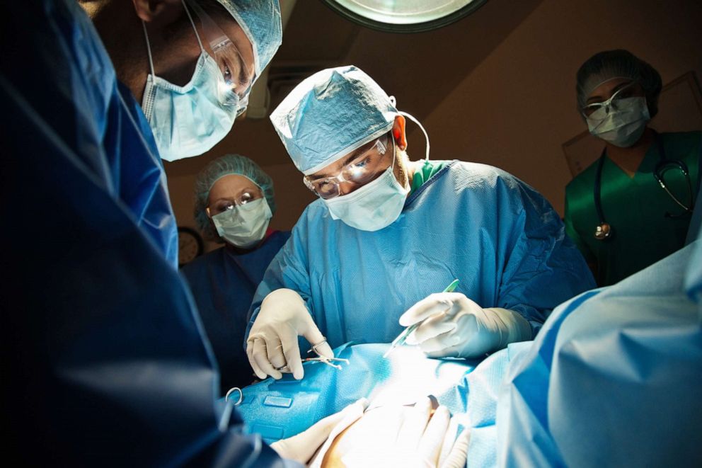 PHOTO: Surgeons perform a C-Section in operating room in an undated stock photo. 