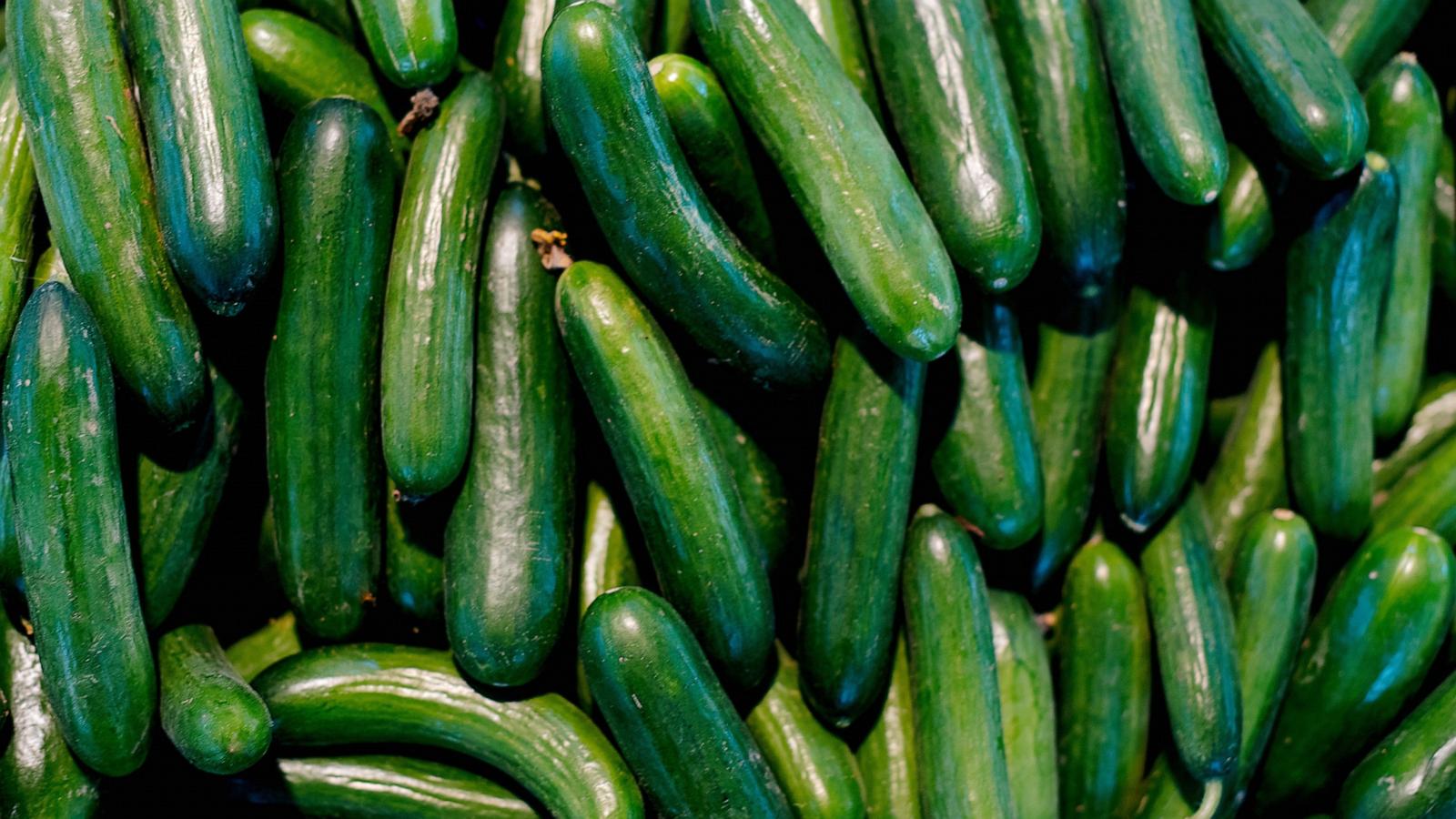 PHOTO: Green cucumbers on shelf in supermarket.