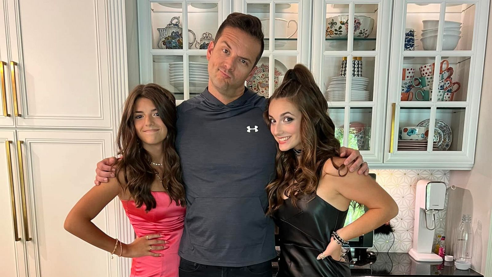 PHOTO: Matt Austin, a news anchor for WKMG-TV in Orlando, poses with his two daughters before their homecoming dance.