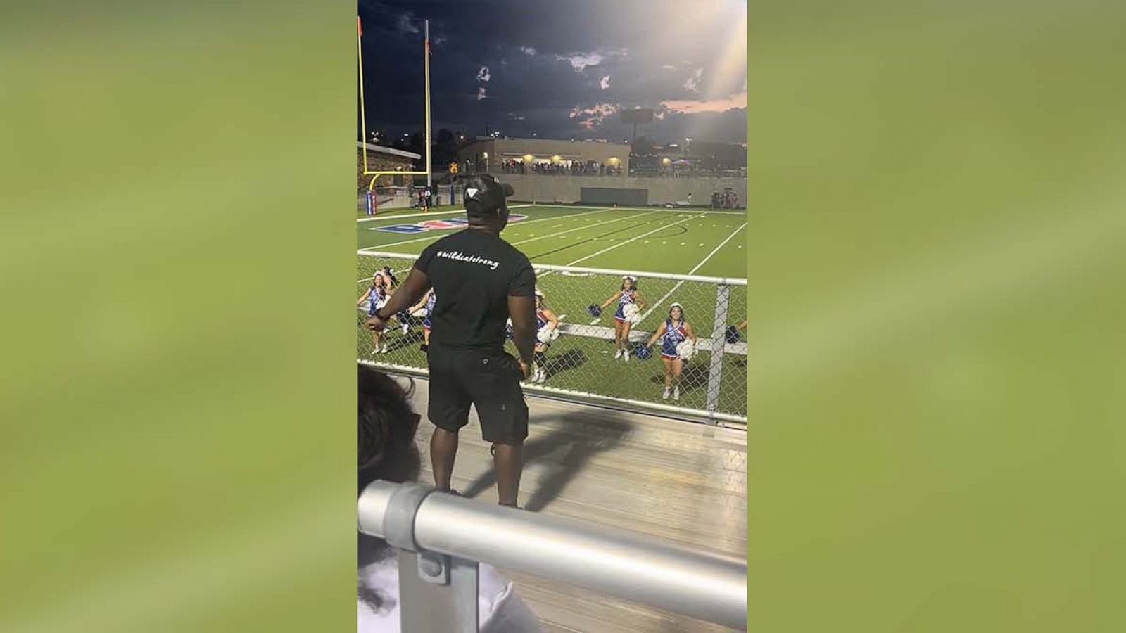 PHOTO: Cecelia Simmons captured her husband Andre Simmons cheering alongside their daughter Jazlyn and her cheer team.