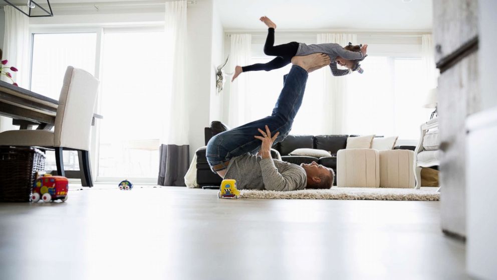 PHOTO: A father plays with his child in this stock photo.