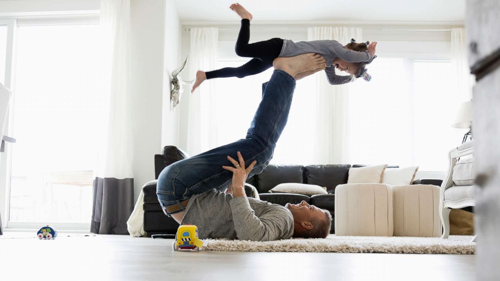 PHOTO: A father plays with his child in this stock photo.