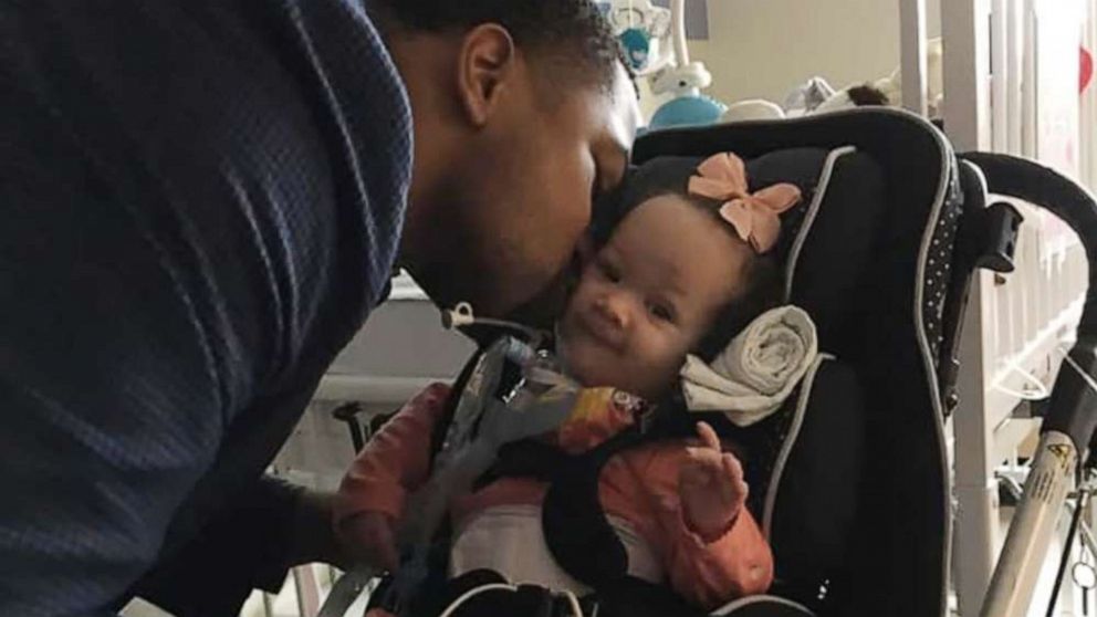 PHOTO: Josh Trimble kisses his daughter Opal.