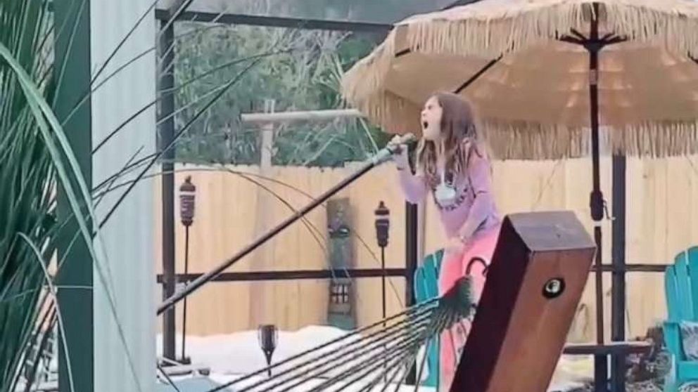 PHOTO: Dad Tom Coverly of Pensacola, Florida, filmed as daughter Annika (Anni), 8, sang her rendition of Alicia Keys' "Girl on Fire" while cleaning her family pool. Coverly posted the video onto TikTok where it was viewed by 9 million.