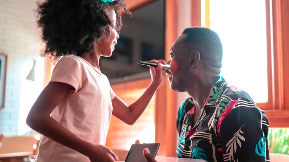 PHOTO: In this undated stock photo, a daughter is seen giving her dad a makeover.