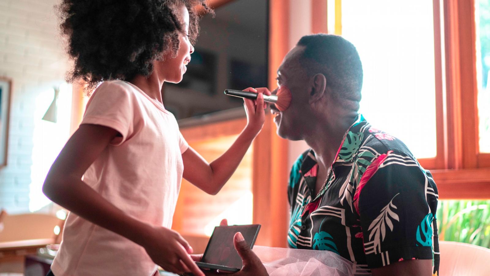 PHOTO: In this undated stock photo, a daughter is seen giving her dad a makeover.