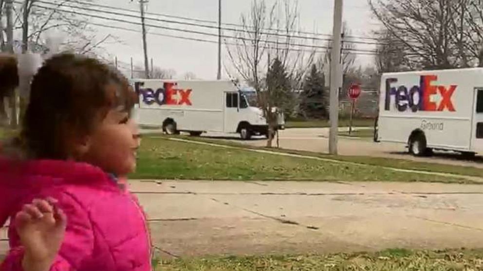 PHOTO: A 4-year-old named Ava Oliver jumped for joy as a fleet of FedEx trucks paraded through her Brook Park, Ohio, neighborhood on March 24 after her birthday party was canceled due to the novel coronavirus shutdown.