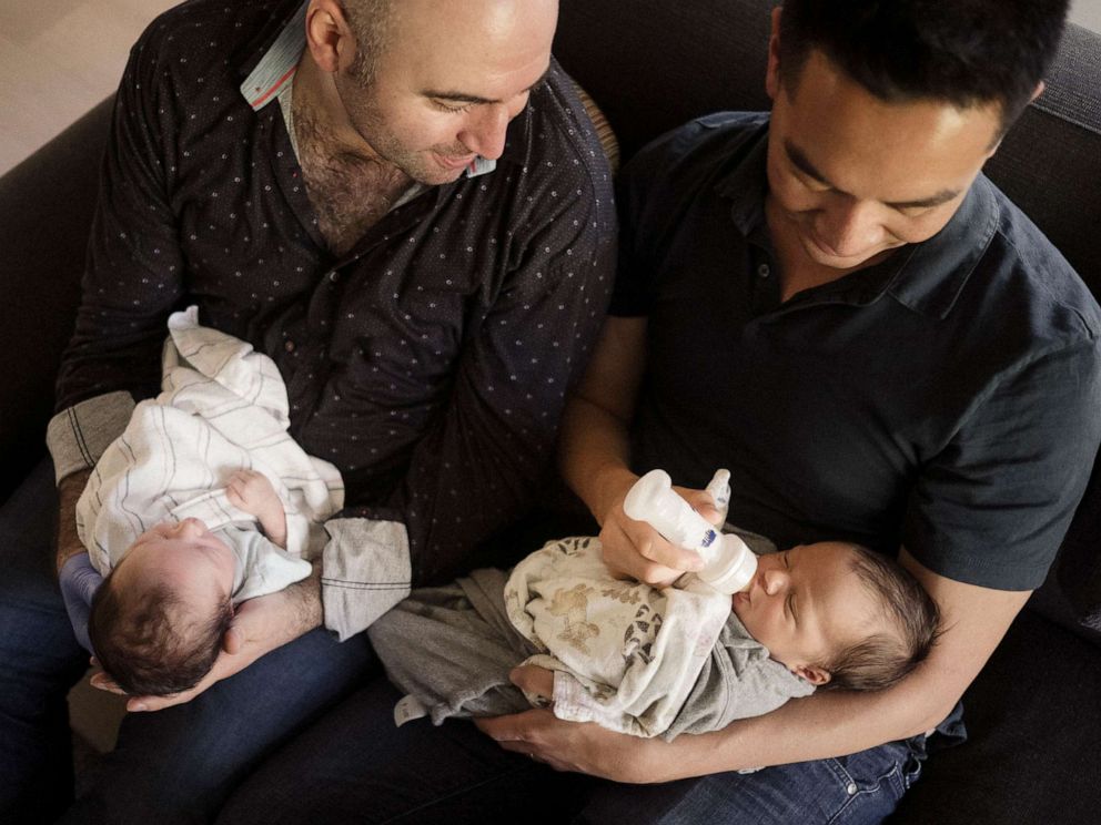 PHOTO: George Arison, right, and his husband Robert Luo welcomed their children, Luka and Emilia, in September 2019.