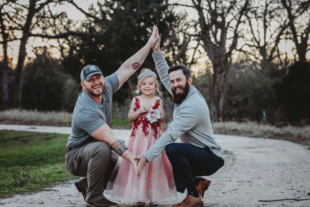 PHOTO: Dylan Lenox (left) is pictured with David Lewis (right) and their daughter Willow (center) before a daddy-daughter dance. 
